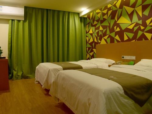 Katil atau katil-katil dalam bilik di Vatica Suzhou Yongqiao District Yinhe 2 Road Wanda Plaza Hotel