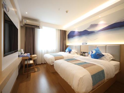 Posteľ alebo postele v izbe v ubytovaní Greentree Inn Shanghai Zhongshan Hutai Business Hotel
