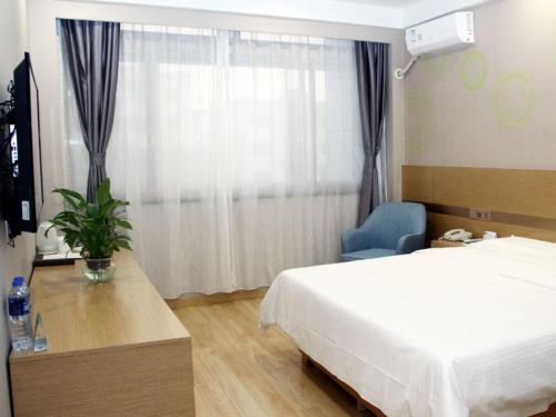 Ένα ή περισσότερα κρεβάτια σε δωμάτιο στο GreenTree Inn Lvliang Xiaoyi City Fuqian Street Hotel