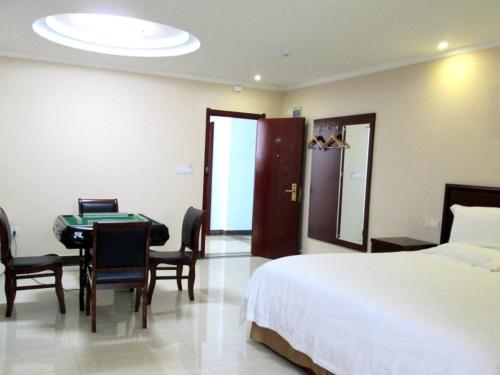 Ένα ή περισσότερα κρεβάτια σε δωμάτιο στο GreenTree Inn Anhui Suzhou Dangshan Dayukou Express Hotel