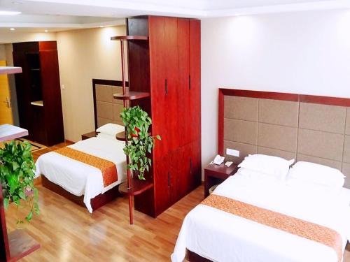 GreenTree Alliance Ningxia Hui Autonomous Region Yinchuan South Bus Station Hotelにあるベッド