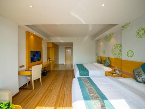 Katil atau katil-katil dalam bilik di GreenTree Inn Qionghai Boao Railway Station Business Hotel