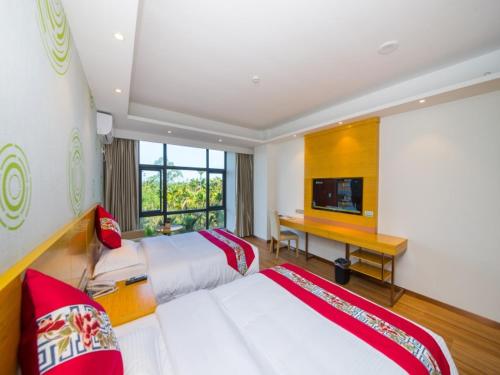 Katil atau katil-katil dalam bilik di GreenTree Inn Qionghai Boao Railway Station Business Hotel