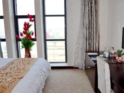 Katil atau katil-katil dalam bilik di GreenTree Inn JiangSu YanCheng West Bus Station Business Hotel