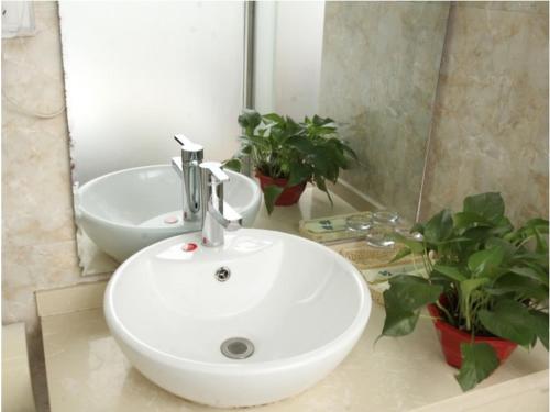 Ένα μπάνιο στο GreenTree Alliance ZhangJiaKou Jingkai District Weisan Road Jiye Hotel