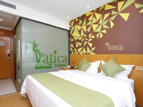 Ένα ή περισσότερα κρεβάτια σε δωμάτιο στο Vatica Hefei Silihe Road wen One hundred street Hotel