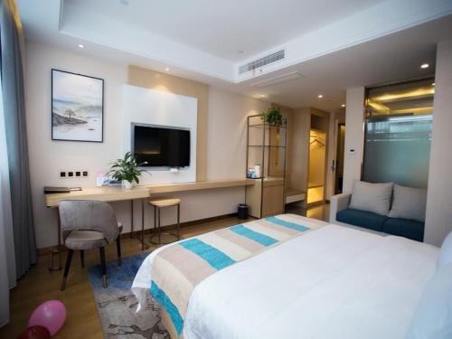 Katil atau katil-katil dalam bilik di VX Heze Dingtao District Taoyi Road Hotel