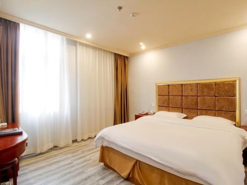 Postel nebo postele na pokoji v ubytování GreenTree Inn AnHui HeFei BinHu New District FangXin Avenue Sichuan Road Express Hotel