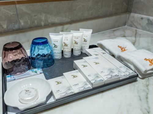 a tray with some items on a counter at GreenTree Eastern Xuzhou High Speed Railway Station Square Yindi Automobile Market Hotel in Xuzhou