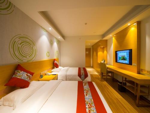 Katil atau katil-katil dalam bilik di GreenTree Inn Qionghai Boao Railway Station Business Hotel