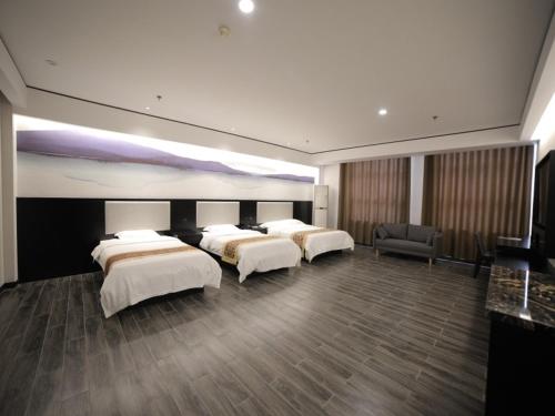 Säng eller sängar i ett rum på GreenTree Inn Jiangsu Nantong Tongzhou District East Bihua Road Business Hotel