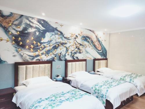 Postelja oz. postelje v sobi nastanitve Shell Maanshan City Hanshan County Huanfeng North Road City Center Hotel