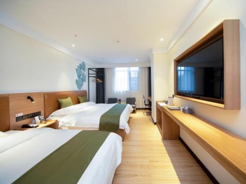 Katil atau katil-katil dalam bilik di GreenTree Inn Kunming Nanping Pedestrian Street Hotel