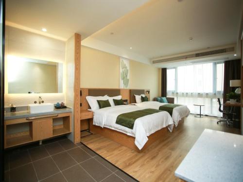 Katil atau katil-katil dalam bilik di GreenTree Inn Huai'an High-speed Railway Station University City East Yan'an Road