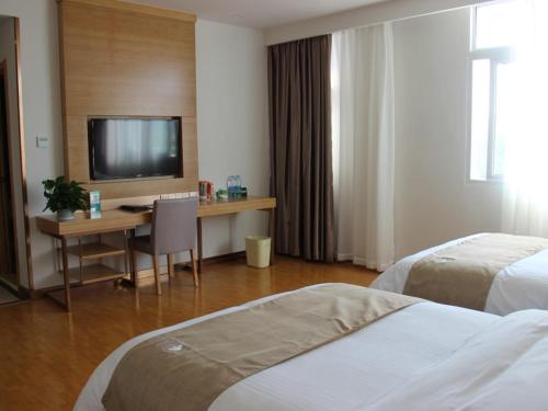 Postel nebo postele na pokoji v ubytování GreenTree Inn Lu'an Jin'an District North Bus Station Express Hotel