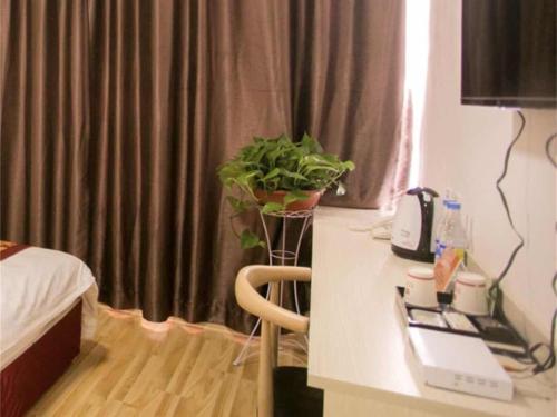 Katil atau katil-katil dalam bilik di Shell Shandong Weifang Linqu Donghuan road Hotel