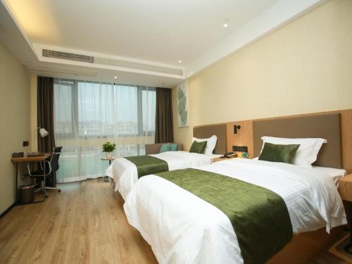Katil atau katil-katil dalam bilik di GreenTree Inn Huai'an High-speed Railway Station University City East Yan'an Road