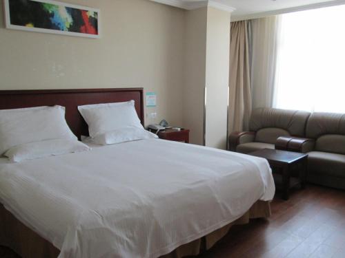 Ένα ή περισσότερα κρεβάτια σε δωμάτιο στο GreenTree Inn Anhui Suzhou Dangshan Dayukou Express Hotel