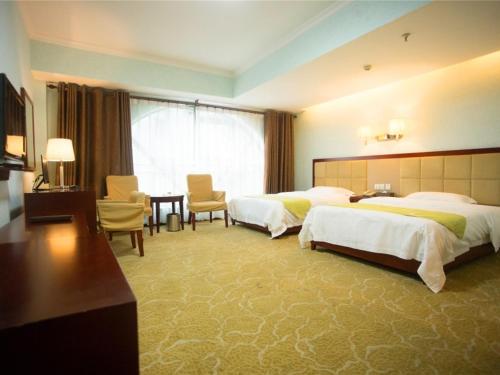 Rúm í herbergi á GreenTree Alliance Nanping Yanping District Xinjian Road Hotel