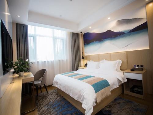 Katil atau katil-katil dalam bilik di VX Heze Dingtao District Taoyi Road Hotel