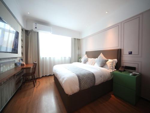 Ένα ή περισσότερα κρεβάτια σε δωμάτιο στο GMA Hotel ShangHai WuNing Road ZhenPing Road Metro Station