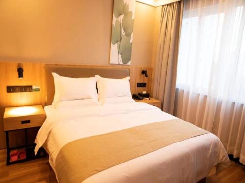 Katil atau katil-katil dalam bilik di GreenTree Inn Suzhou Railway Station Park Road Hotel