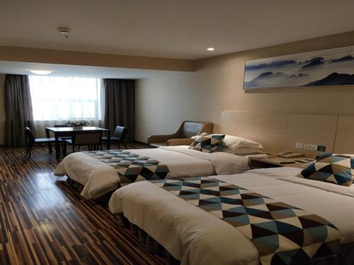 Postel nebo postele na pokoji v ubytování GreenTree Alliance JiangSu Province Lianyungang Nanchang Road Hotel