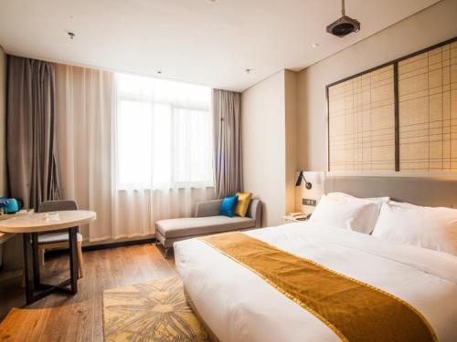 Ліжко або ліжка в номері GreenTree Eastern Lianyungang Jiaruibao Plaza Hotel