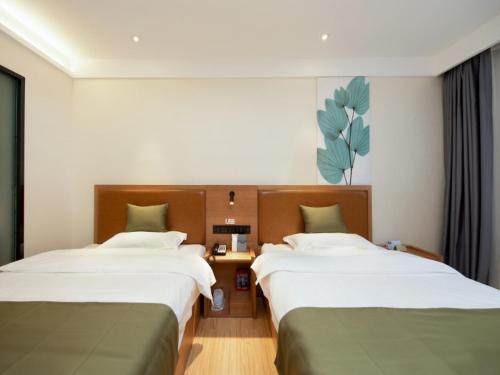 Katil atau katil-katil dalam bilik di GreenTree Inn Kunming Nanping Pedestrian Street Hotel