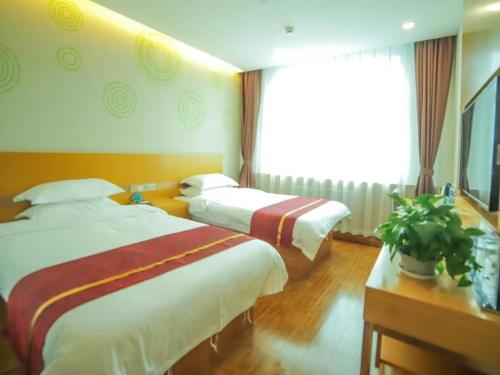 GreenTree Inn Beijing Huairou District Beifang Town Xingfu Avenue Business Hotel 객실 침대