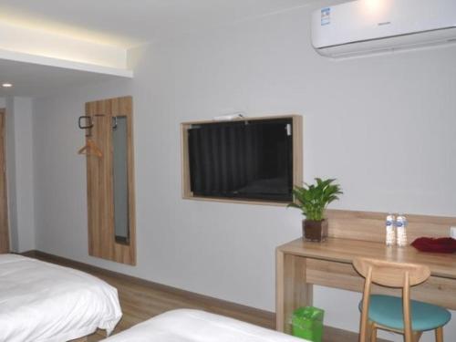 Postel nebo postele na pokoji v ubytování Shell Suzhou Yongqiao District Dongchang Road National Purchase Square Hotel