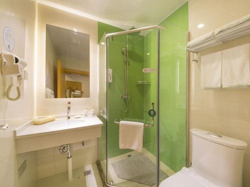 a bathroom with a shower and a toilet and a sink at GreenTree Inn Beijing Tongzhou District Xuxinzhuang Subway Station Express Hotel in Beijing