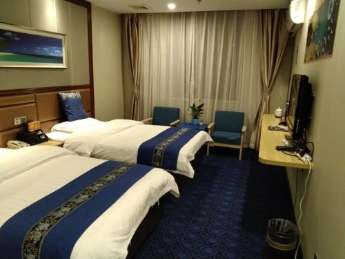Katil atau katil-katil dalam bilik di GreenTree Alliance Xinyang Pingqiao District Nanjing Road Dongyang Hotel