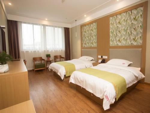 En eller flere senge i et værelse på Shell Changzhou Yangrong City Hotel