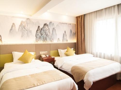 Llit o llits en una habitació de GreenTree Inn Zhejiang Ningbo Passenger Transport Center Tongda Road Shell Hotel
