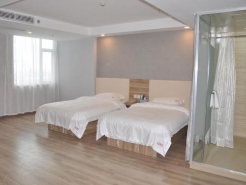 Postel nebo postele na pokoji v ubytování Shell Suzhou Yongqiao District Dongchang Road National Purchase Square Hotel