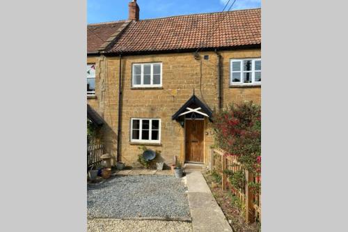 an image of a brick house with a driveway at Spaniel Cottage with views of Ham hill, Stoke sub Hamdon in Martock