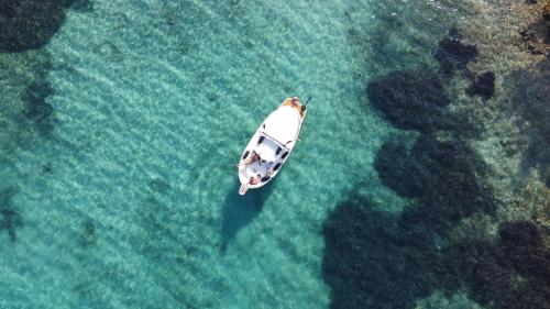 an aerial view of a boat in the water at Apartments Antares in Mali Lošinj