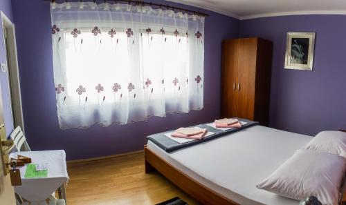 Ένα ή περισσότερα κρεβάτια σε δωμάτιο στο Rooms Daniela