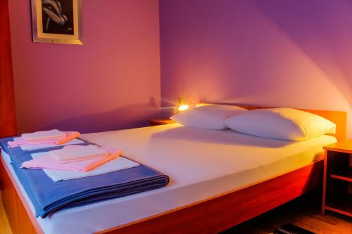 Ένα ή περισσότερα κρεβάτια σε δωμάτιο στο Rooms Daniela