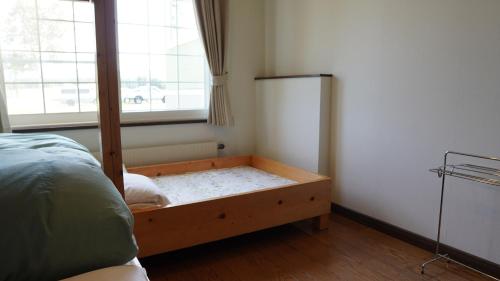 Cama o camas de una habitación en Kiyosato IHATOV Hostel