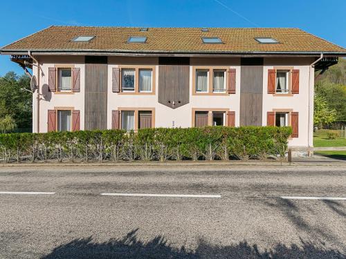 a house on the side of a road at Spacious Apartment in La Bresse with Terrace in La Bresse