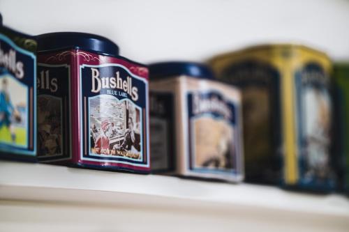 three cans of beer sitting on a shelf at Johnstone Terrace in Castlemaine