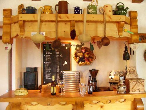 a kitchen with a counter with pots and pans at Chalet Titlis in Bernex