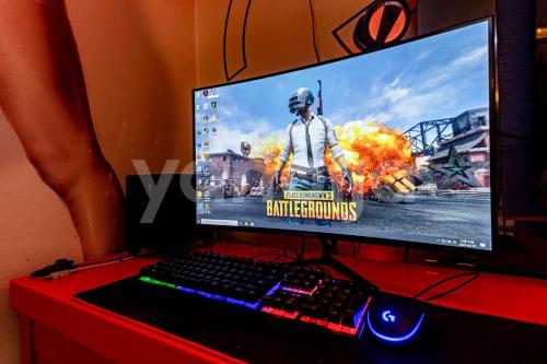 a computer monitor and a keyboard and mouse on a desk at Jinju GnG Motel in Jinju