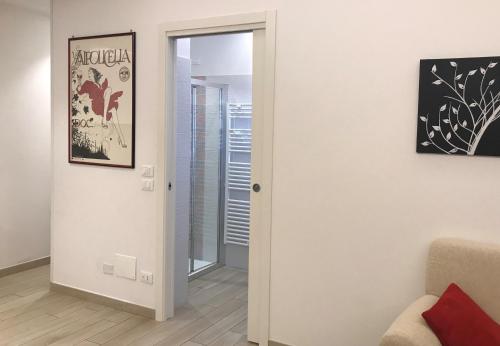 a room with a door leading to a living room at Valpolicella Hills in Negrar