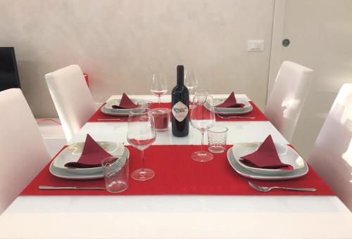 a table with red napkins and wine glasses on it at Valpolicella Hills in Negrar
