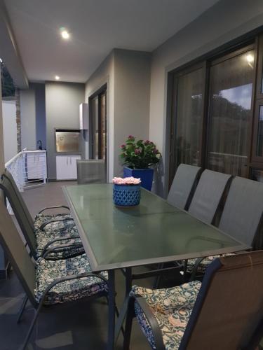 a green table and chairs in a living room at Westbrook Cabanas Unit 3 in Westbrook