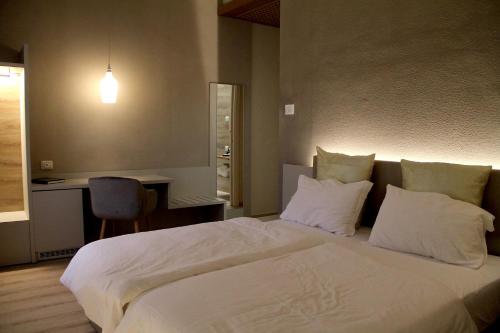 Llit o llits en una habitació de Albergo Ristorante Palladio Osteria dal 1900