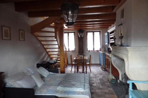 a bedroom with a bed and a table in a room at Die Kleine Auszeit in Wadern